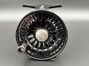 Abel TR fly reel in Black finish with ported spool and palming rim