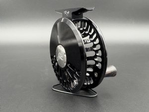 Abel TR fly reel in Black finish with ported spool and palming rim