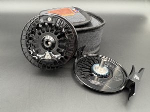 Abel TR fly reel in Black finish with ported spool and palming rim