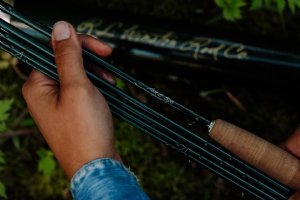 Winston AIR 2 five-piece fly rod in classic Winston green with tube and sock - Hero Shot